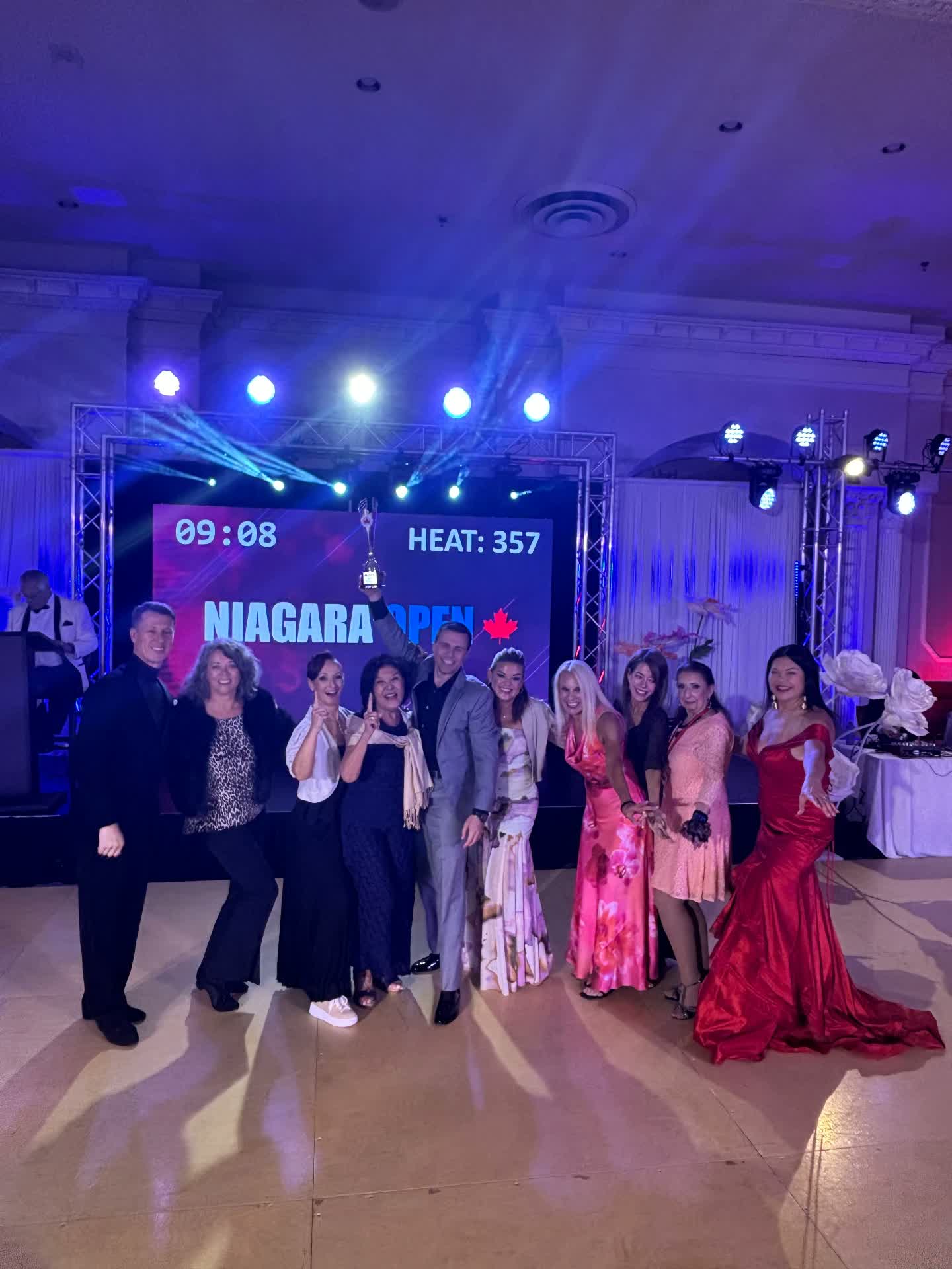 Group photo in front of the Niagara Open screen