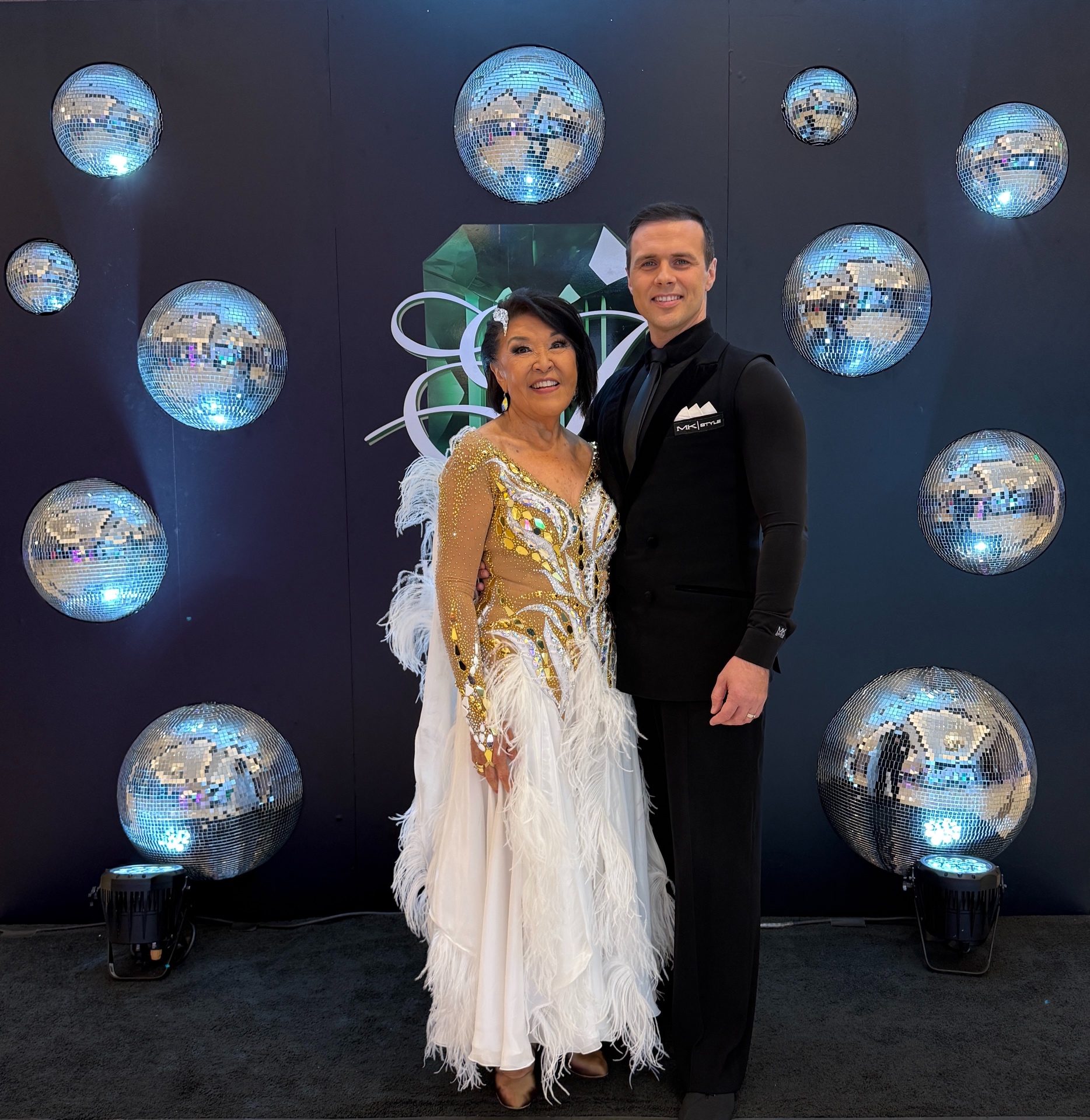 Student and instructor among disco balls