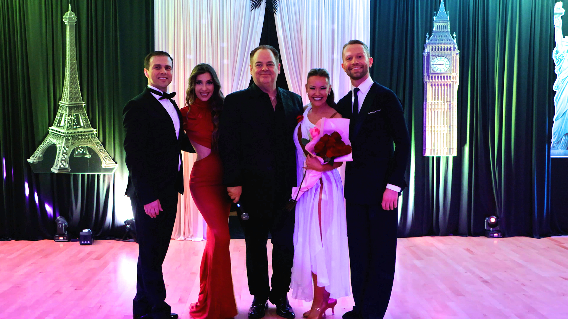 Paramount Ballroom showcase performers with Eiffel Tower and Big Ben backdrops